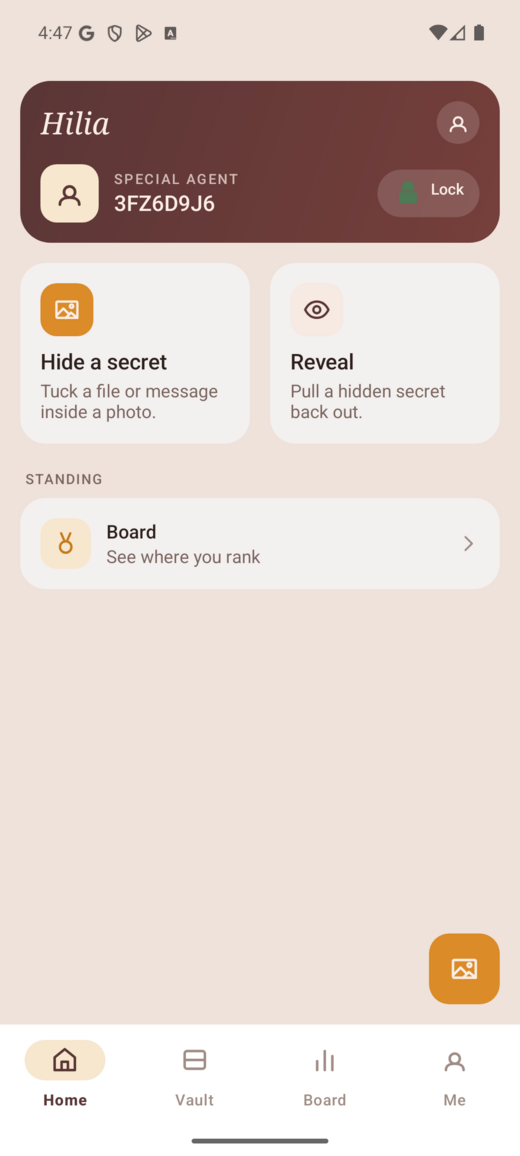 The HILIA app home screen with Hide a secret and Reveal cards and the bottom tab bar